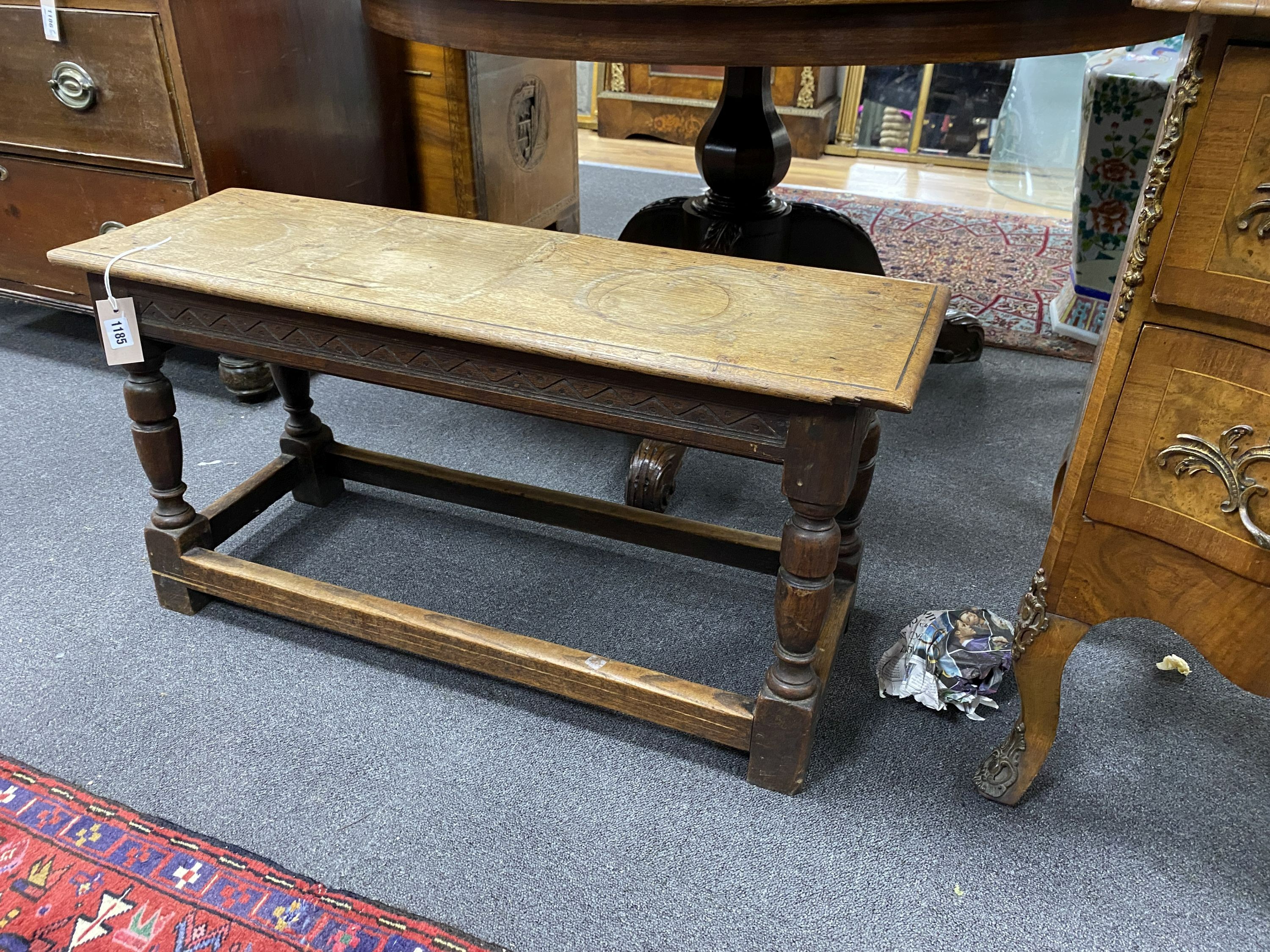 An 18th century style oak stool, length 92cm, depth 30cm, height 46cm